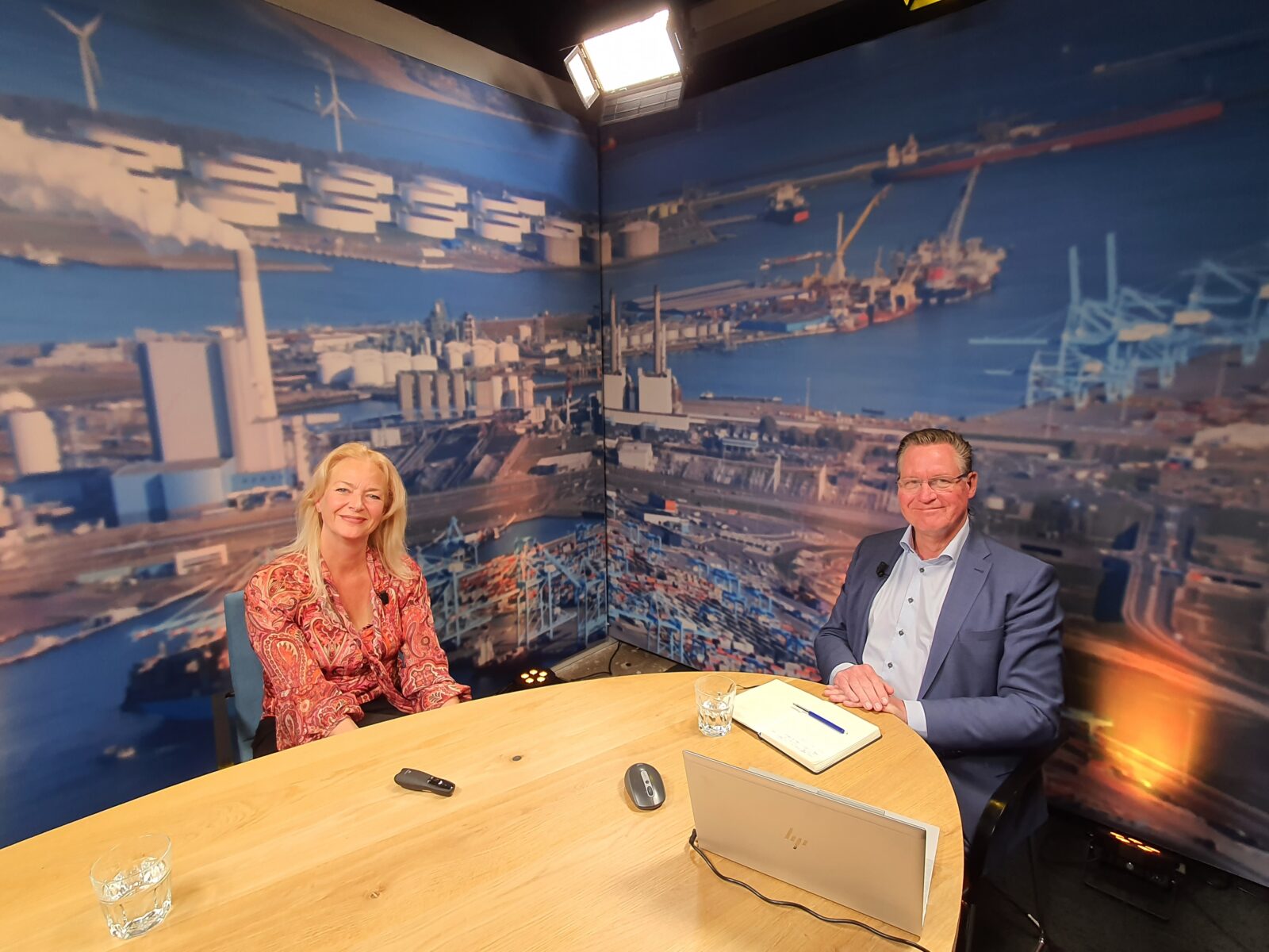 Two pesons in a recording studio for a webinar