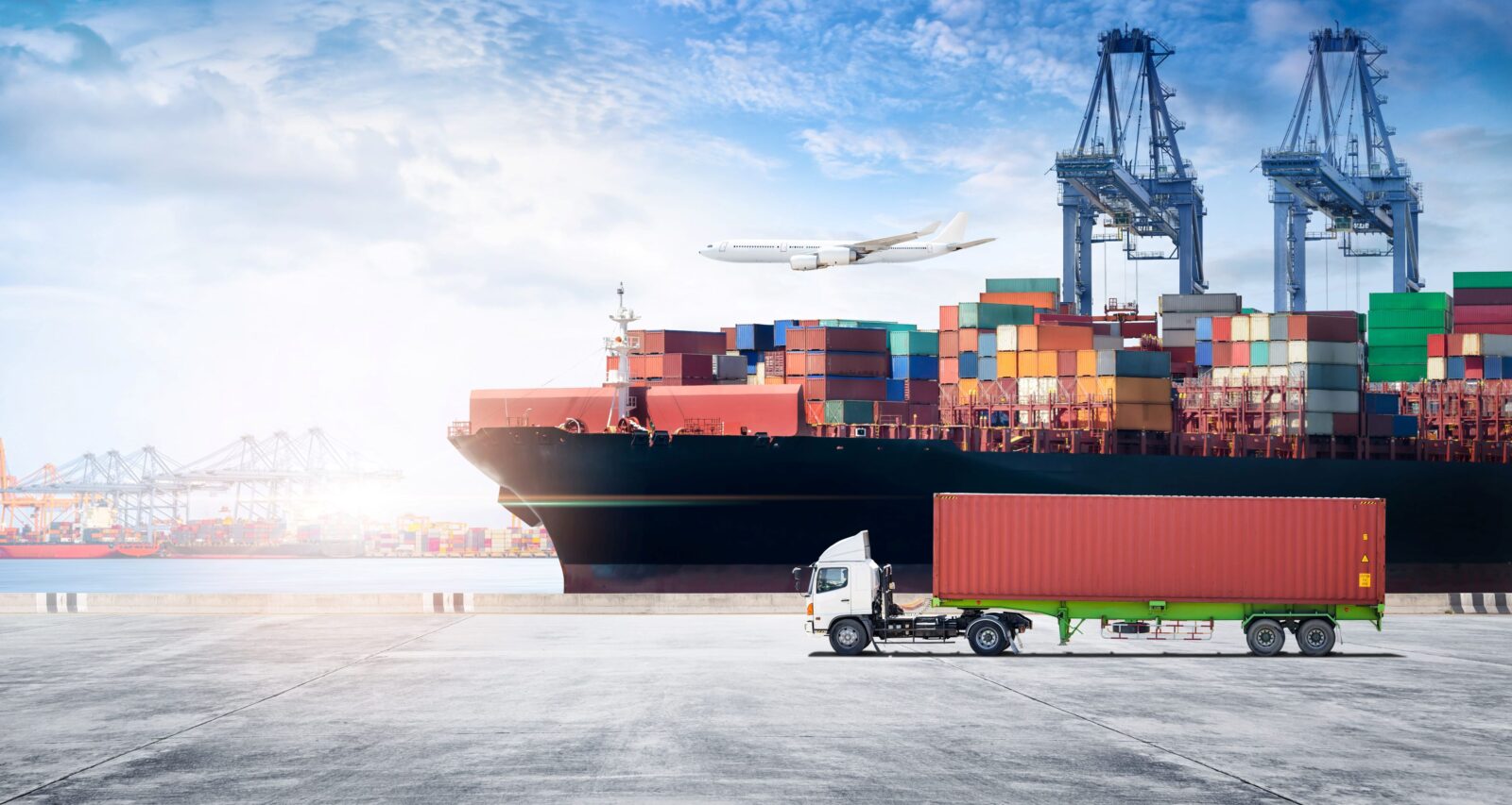 A container boat, plane and a truck